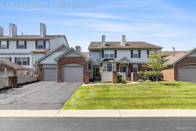 49649 Draper Cir, Plymouth, MI 48170 - multi unit property with brick siding, asphalt driveway, and a garage