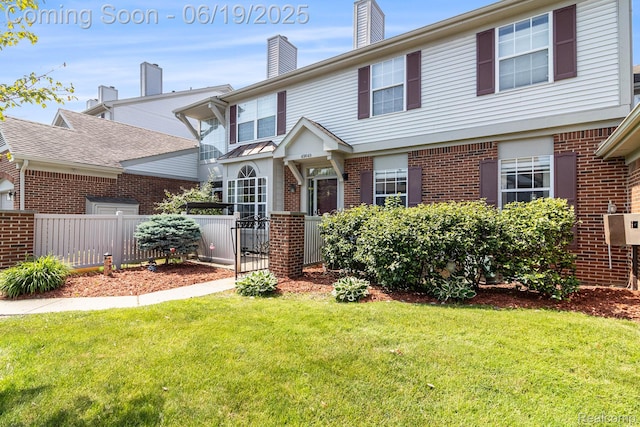 49649 Draper Cir, Plymouth, MI 48170 - view of front facade with brick siding, a chimney, and a gate
