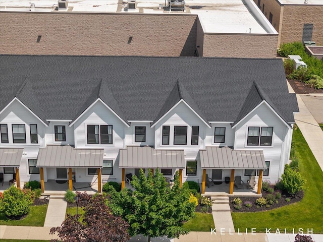 2519 Inverness Rd SE, Grand Rapids, MI 49546 - view of front of house with a standing seam roof, a metal roof, and a porch