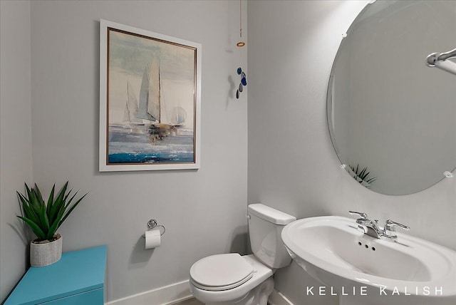 2519 Inverness Rd SE, Grand Rapids, MI 49546 - half bath featuring a sink and toilet