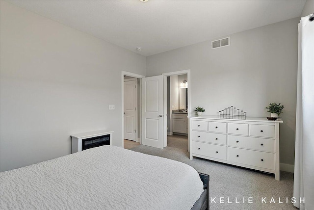 2519 Inverness Rd SE, Grand Rapids, MI 49546 - bedroom with carpet and connected bathroom