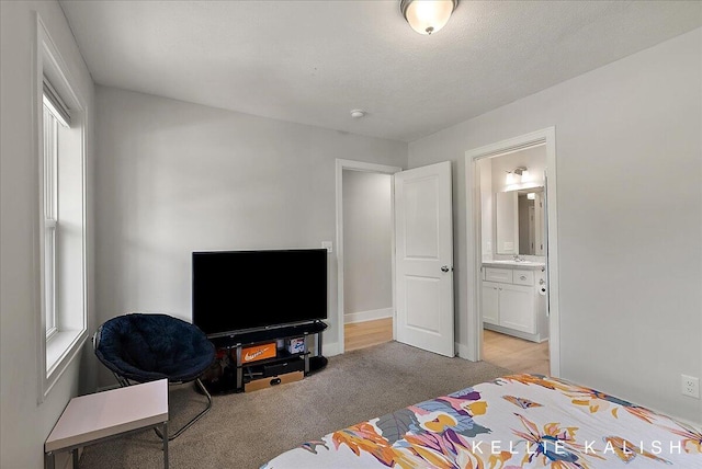 2519 Inverness Rd SE, Grand Rapids, MI 49546 - bedroom featuring light carpet and ensuite bath