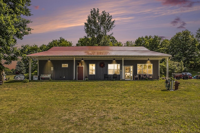 780 S 72nd Ave, Shelby, MI 49455 - view of front facade with board and batten siding, a lawn, and a metal roof