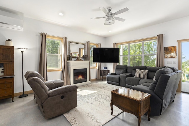 780 S 72nd Ave, Shelby, MI 49455 - living area featuring a wall mounted air conditioner, ceiling fan, plenty of natural light, and a glass covered fireplace