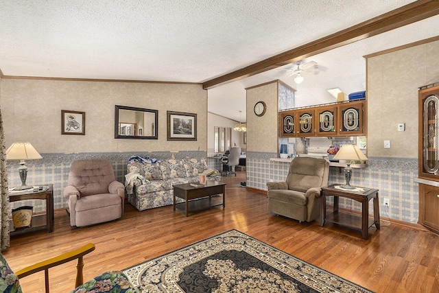 720 S 72nd Ave, Shelby, MI 49455 - living room with wood finished floors, a textured ceiling, a wainscoted wall, a ceiling fan, and wallpapered walls