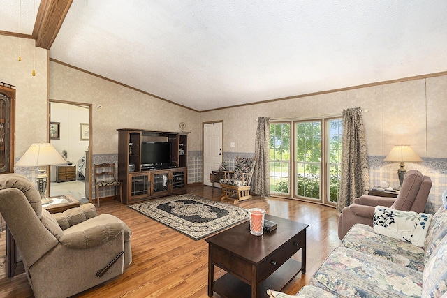 720 S 72nd Ave, Shelby, MI 49455 - living room featuring vaulted ceiling, wood finished floors, crown molding, and a textured ceiling