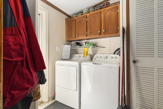 720 S 72nd Ave, Shelby, MI 49455 - laundry area featuring washer and dryer, crown molding, cabinet space, and a textured ceiling