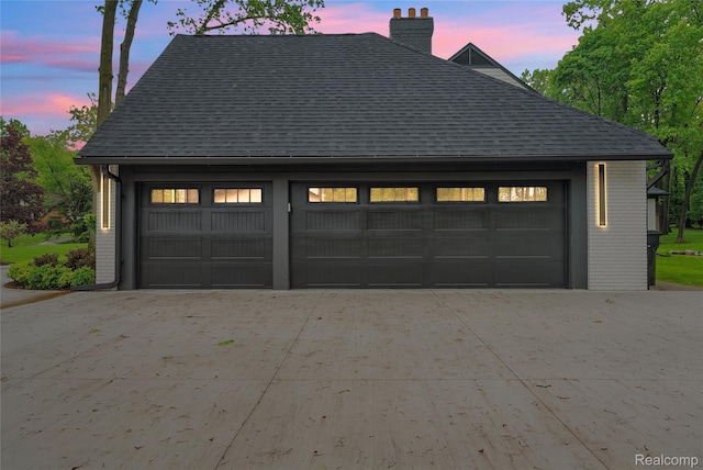 163 Manorwood Dr, Bloomfield Hills, MI 48304 - garage at dusk featuring a detached garage