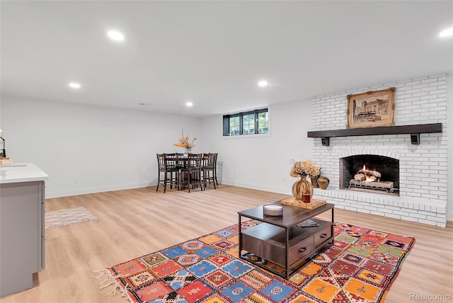 163 Manorwood Dr, Bloomfield Hills, MI 48304 - living area with light wood-style floors, a brick fireplace, and recessed lighting