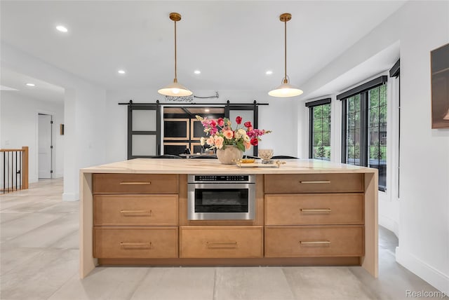 163 Manorwood Dr, Bloomfield Hills, MI 48304 - kitchen with oven, a barn door, recessed lighting, decorative light fixtures, and a kitchen island
