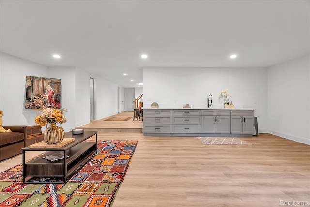 163 Manorwood Dr, Bloomfield Hills, MI 48304 - living room with stairway, light wood-style flooring, recessed lighting, and bar