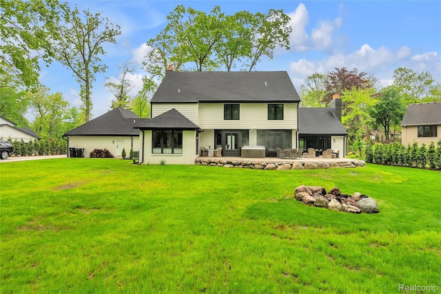 163 Manorwood Dr, Bloomfield Hills, MI 48304 - rear view of property with a fire pit, a lawn, a patio area, and an attached garage
