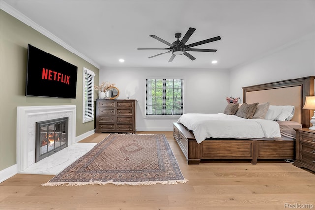 163 Manorwood Dr, Bloomfield Hills, MI 48304 - bedroom featuring crown molding, recessed lighting, light wood-style floors, a high end fireplace, and ceiling fan