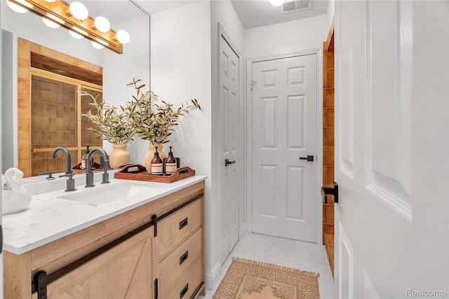 163 Manorwood Dr, Bloomfield Hills, MI 48304 - bathroom featuring vanity and marble look tile flooring