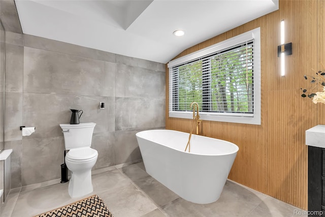 163 Manorwood Dr, Bloomfield Hills, MI 48304 - bathroom featuring a freestanding tub, lofted ceiling, and wooden walls