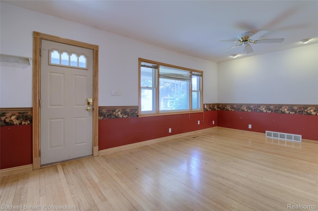 21732 Tenny St, Dearborn, MI 48124 - foyer entrance featuring healthy amount of natural light, a ceiling fan, wood-type flooring, and a wainscoted wall