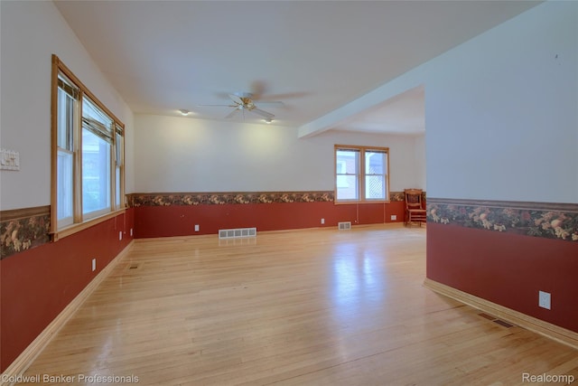21732 Tenny St, Dearborn, MI 48124 - empty room with wainscoting, ceiling fan, and light wood finished floors