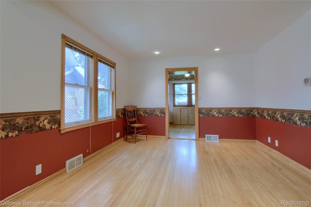 21732 Tenny St, Dearborn, MI 48124 - empty room featuring hardwood / wood-style floors, a wainscoted wall, and recessed lighting