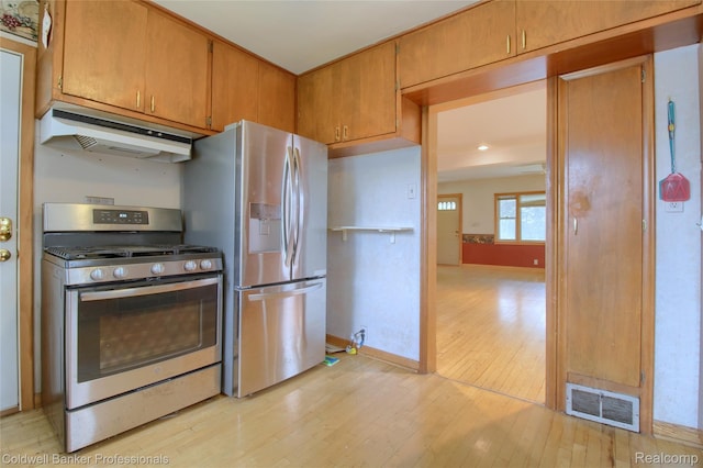 21732 Tenny St, Dearborn, MI 48124 - kitchen featuring stainless steel appliances, custom exhaust hood, light wood finished floors, and brown cabinets