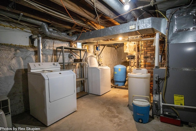 3193 W 112th St, Grant, MI 49327 - unfinished below grade area featuring separate washer and dryer, a water pressure tank, and a water softener