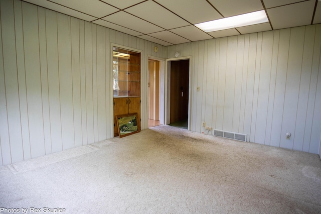 3193 W 112th St, Grant, MI 49327 - carpeted spare room with a drop ceiling and wooden walls