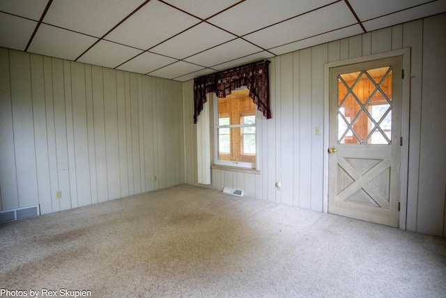 3193 W 112th St, Grant, MI 49327 - carpeted empty room with a drop ceiling and wooden walls