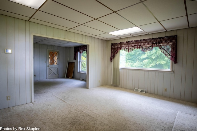 3193 W 112th St, Grant, MI 49327 - carpeted spare room with a paneled ceiling and wooden walls