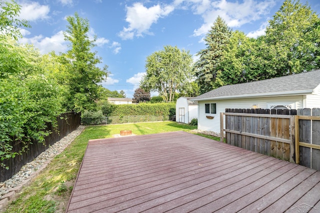 395 S Center Rd, Saginaw, MI 48638 - wooden deck with a fenced backyard and a storage shed