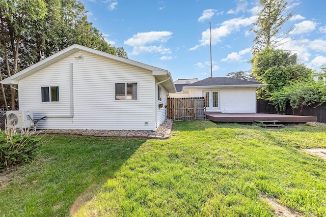 395 S Center Rd, Saginaw, MI 48638 - back of property with a deck and a fenced backyard