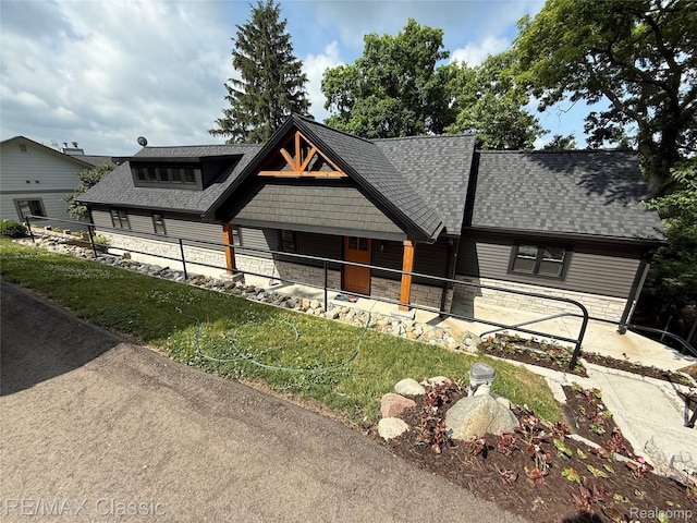 1420 Pettibone Lake Rd, Highland, MI 48356 - view of front of property with stone siding and a shingled roof