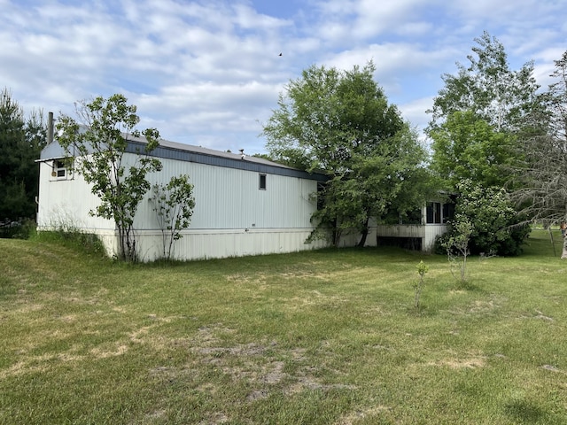 6121 N Pine Ave, White Cloud, MI 49349 - view of grassy yard with an outdoor structure