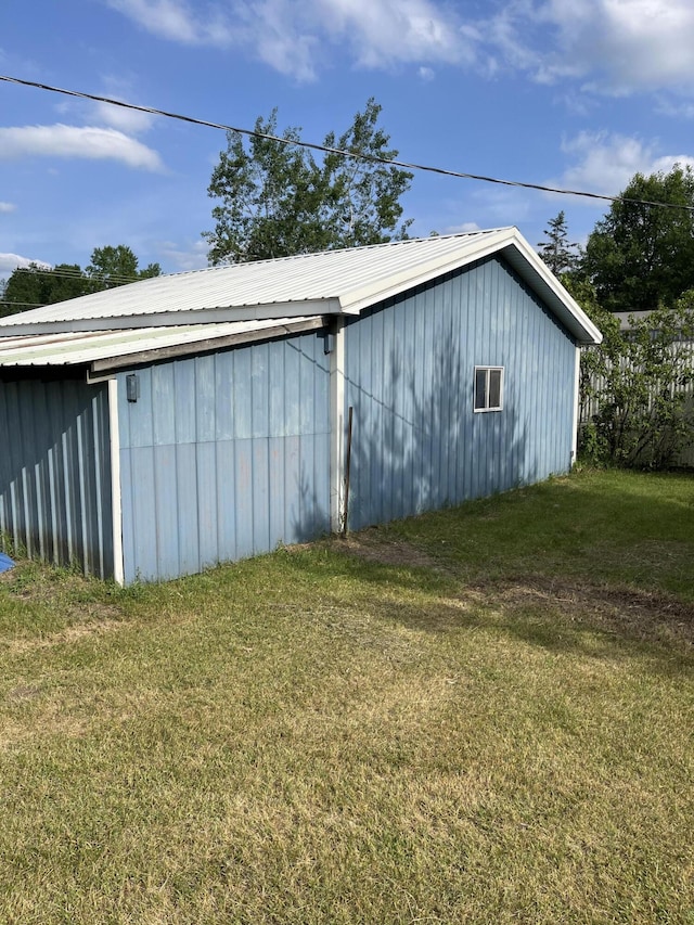 6121 N Pine Ave, White Cloud, MI 49349 - view of pole building featuring a yard
