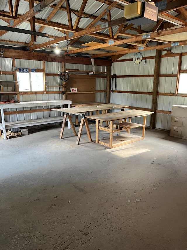 6121 N Pine Ave, White Cloud, MI 49349 - miscellaneous room with a garage and lofted ceiling