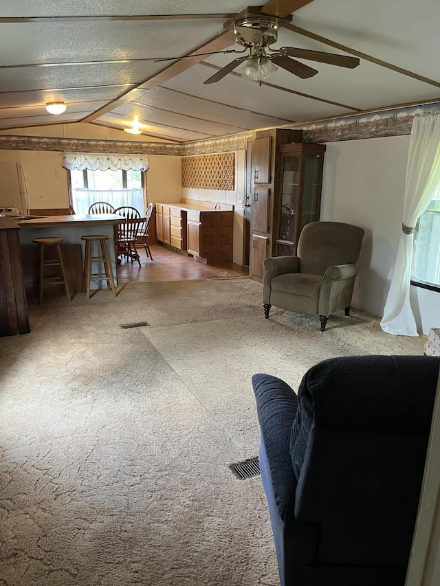6121 N Pine Ave, White Cloud, MI 49349 - carpeted living area with a ceiling fan