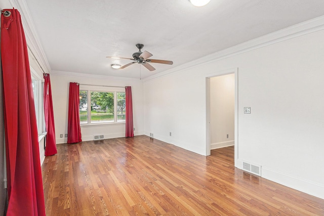 101 E Whittier St, Ludington, MI 49431 - empty room featuring light wood-type flooring, a ceiling fan, and ornamental molding