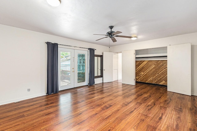 101 E Whittier St, Ludington, MI 49431 - unfurnished bedroom featuring wood finished floors, access to exterior, and a ceiling fan
