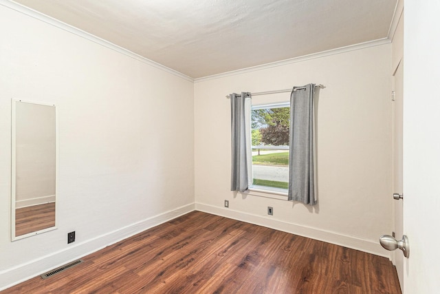 101 E Whittier St, Ludington, MI 49431 - unfurnished room with dark wood finished floors and crown molding