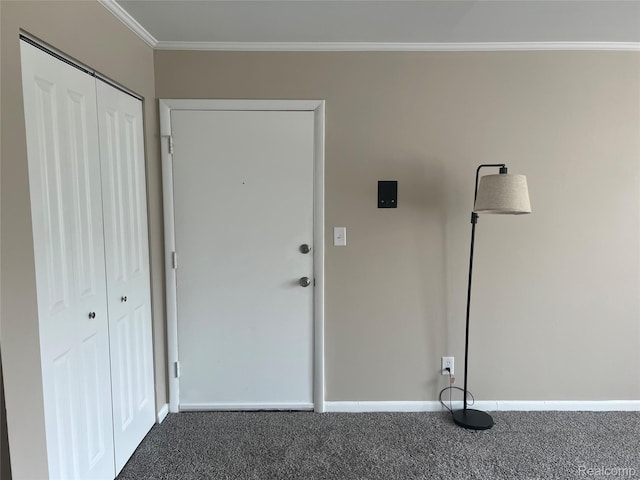 3901 Fort St Unit 202, Riverview, MI 48183 - foyer entrance featuring dark colored carpet and ornamental molding