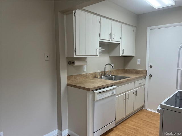 3901 Fort St Unit 202, Riverview, MI 48183 - kitchen with white appliances, light wood-style floors, and white cabinets