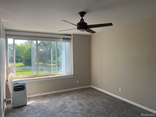 3901 Fort St Unit 202, Riverview, MI 48183 - carpeted empty room featuring healthy amount of natural light and a ceiling fan