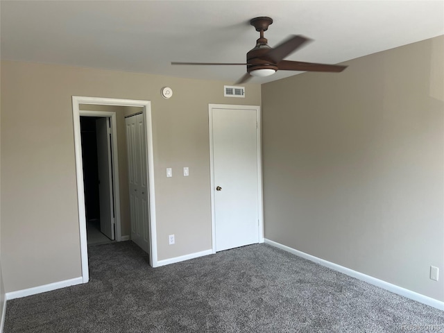 3901 Fort St Unit 202, Riverview, MI 48183 - unfurnished bedroom with dark colored carpet and ceiling fan