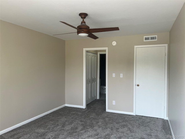 3901 Fort St Unit 202, Riverview, MI 48183 - unfurnished bedroom with dark carpet and ceiling fan