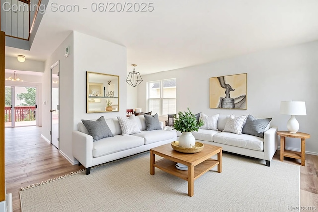 3244 Buckhorn Ct, Ann Arbor, MI 48105 - living area with a chandelier and wood finished floors