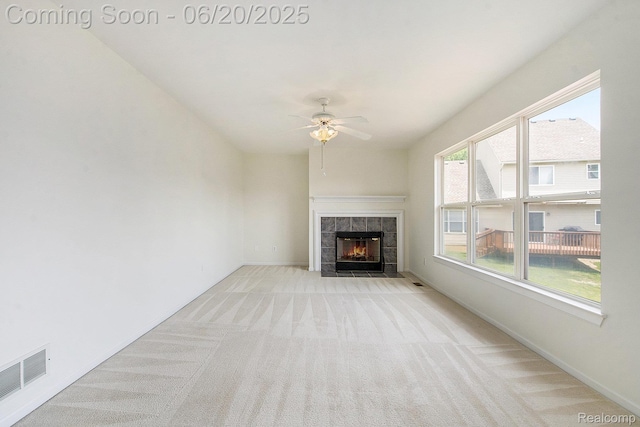3244 Buckhorn Ct, Ann Arbor, MI 48105 - unfurnished living room featuring carpet floors, a tile fireplace, and a ceiling fan