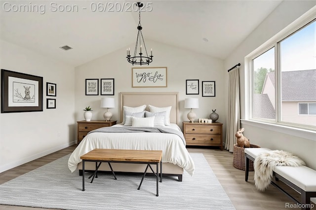 3244 Buckhorn Ct, Ann Arbor, MI 48105 - bedroom with light wood finished floors, lofted ceiling, and a chandelier