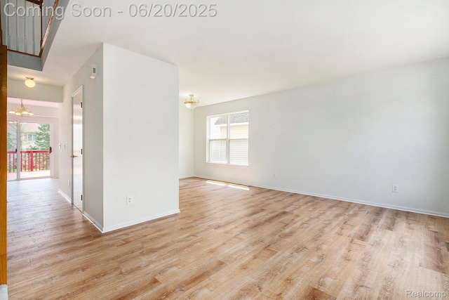 3244 Buckhorn Ct, Ann Arbor, MI 48105 - empty room with a chandelier and light wood-style flooring