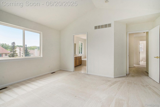 3244 Buckhorn Ct, Ann Arbor, MI 48105 - unfurnished bedroom with multiple windows, vaulted ceiling, light carpet, and ensuite bathroom