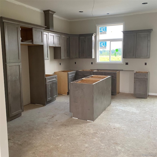 4940 Daisy Ln, Almont, MI 48003 - kitchen with a center island and ornamental molding