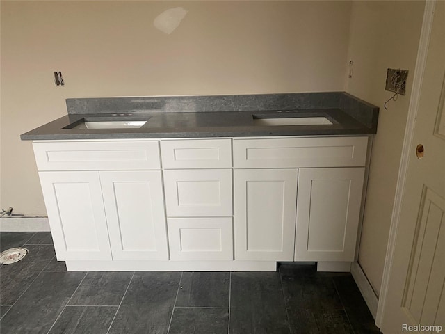 4940 Daisy Ln, Almont, MI 48003 - kitchen featuring white cabinetry and dark countertops