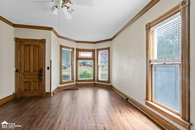 320 E Main St, Flushing, MI 48433 - spare room with wood finished floors, a textured ceiling, plenty of natural light, a ceiling fan, and crown molding